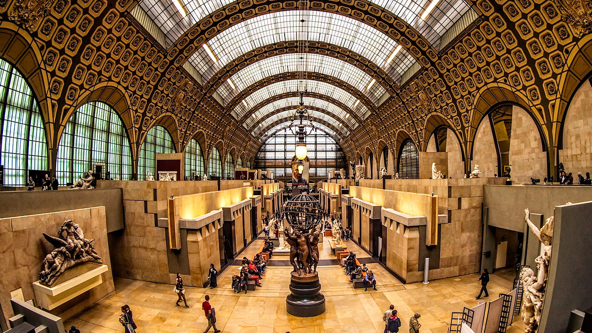 Exterior view of the Musée d'Orsay in Paris, showcasing its grand architecture and iconic glass roof. best time to visit musee d'orsay