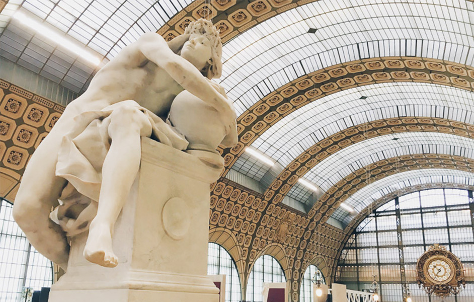 Grand sculptures displayed on the ground floor of the Musée d'Orsay, under its stunning glass ceiling.