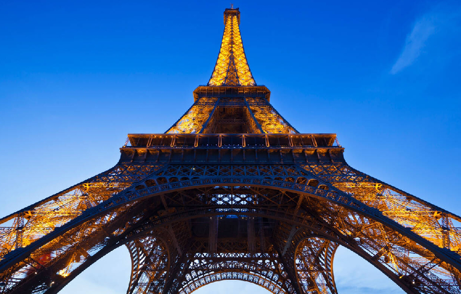 eiffel tower to louvre museum - Close-up of the Eiffel Tower_s iron lattice structure in Paris.