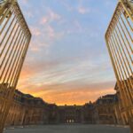 palace of versailles history -Palace of Versailles with golden gates and main courtyard, representing its historical grandeur