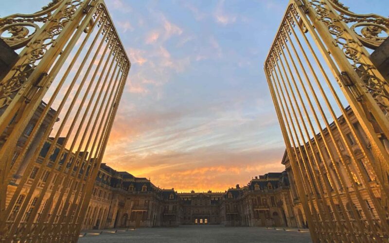 palace of versailles history -Palace of Versailles with golden gates and main courtyard, representing its historical grandeur